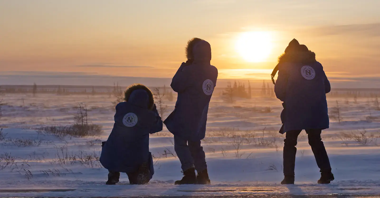 Nat Hab guests at tundra sunset, Churchill, Manitoba